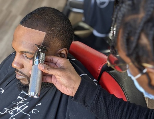 2F Tonys Barber Shop Customer Getting A Line Up 540x415 